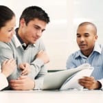 Couple meeting with financial advisor.